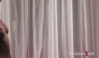 Angie Noir with pretty long hair wears a dress and plays with a hard cock